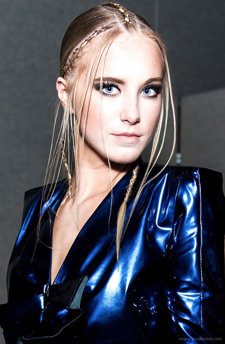 blue leather suit with blonde model with braids